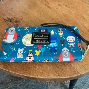 Disney Parks loungefly wristlet.   Good used condition.   Some wearing on edges